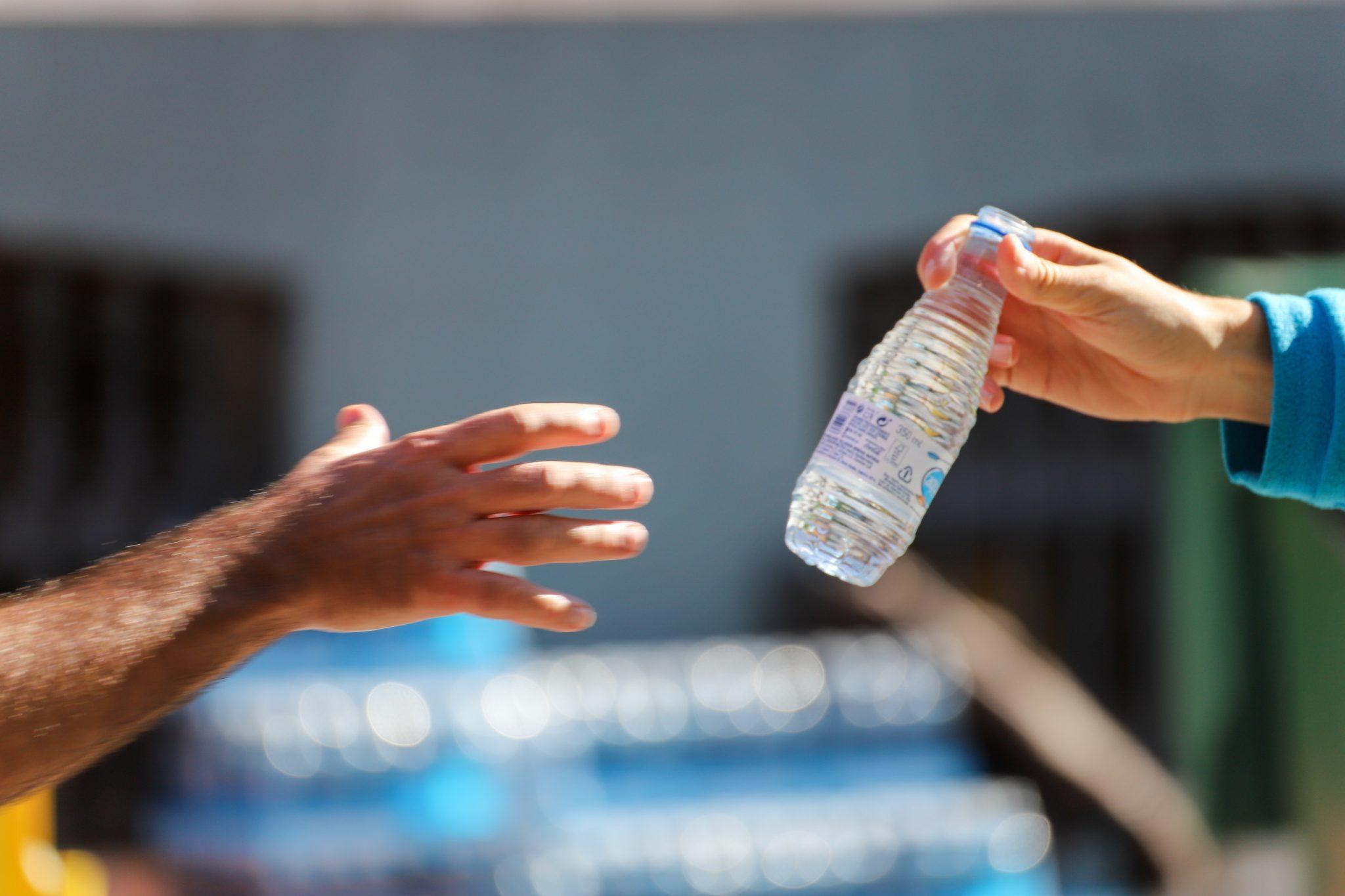 Marathon runner catching water Half Marathon For Beginners