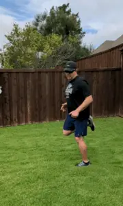 Coach Scott Performing Dynamic Stretches - Butt Kicks